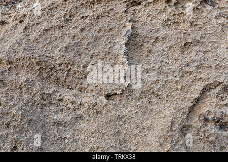 Detail of abstract brown stone texture. For background textures. Natural background to be used in old architecture context as rough wallpaper. Stock Photo