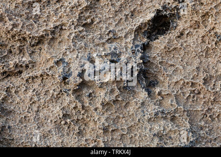Detail of abstract brown stone texture. For background textures. Natural background to be used in old architecture context as rough wallpaper. Stock Photo