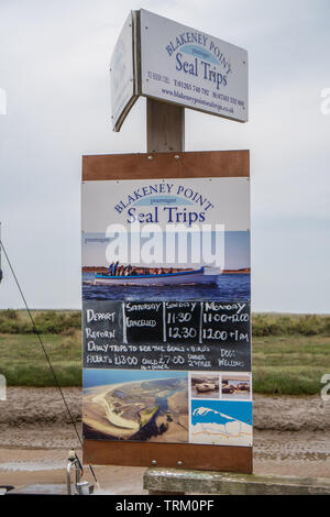 Adverts for seal spotting boat trips at Blakeney, Norfolk, UK Stock Photo