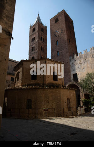 Baptistry and towers in a sunny day. Vertical shot. Albenga, Liguria, Italy. Stock Photo