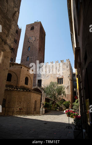 Baptistry, Palazzo Vecchio and civic tower in a sunny day. Vertical shot. Albenga, Liguria, Italy. Stock Photo