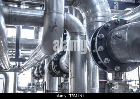 industrial steam pipe with valves and stainless steel actuators Stock Photo