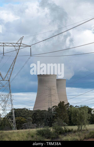 Steam rises from the giant cooling towers at the coal powered Bayswater Power Station in the Hunter Valley near Singleton, New South Wales, Australia Stock Photo