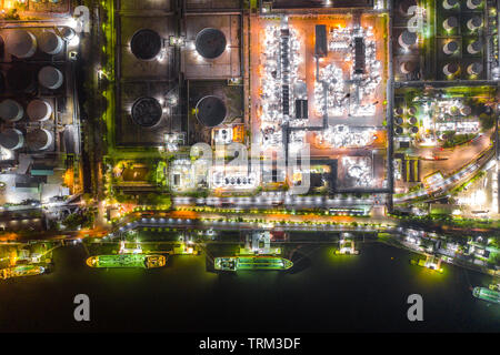 Oil tanker ship loading in port at oil refinery, Aerial view from above. Stock Photo