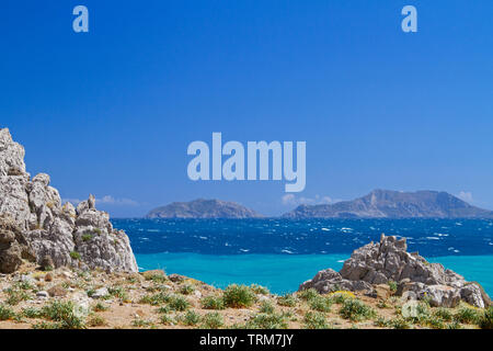 View over the blue mediterranean sea on the uninhabited Paximadia Islands from the coast of Crete, near Aghios Pavlos Stock Photo