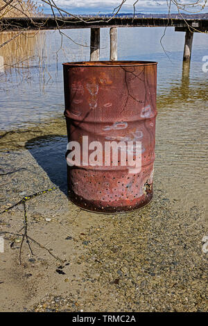 perforated old rusty barrel Stock Photo