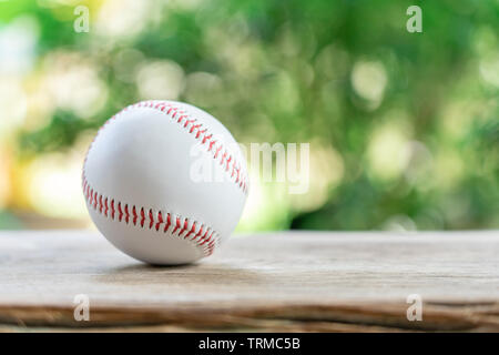 baseball on Abstract background and red stitching baseball. White baseball with red thread.Baseball is a national sport of Japan. It is popular. Stock Photo