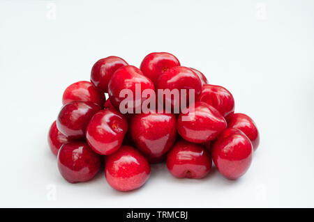 Cherries pile on white background Stock Photo