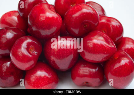 Cherries pile macro on white background Stock Photo