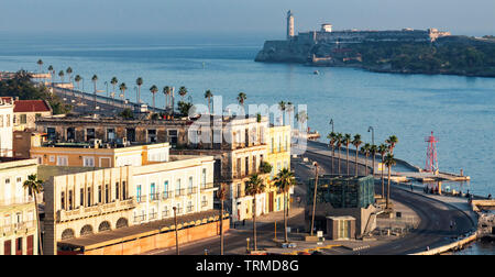 Havana, Cuba - 25 July 2018: View of El Malecon looking down canal out to sea toward the fort from the top of a cruise ship at sunrise. Stock Photo