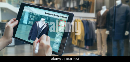 augmented mixed virtual reality to design a clothes in 3D fashion design software program creating virtual, true-to life garment visualization with cu Stock Photo