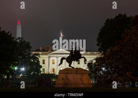Andrew Jackson statue in Lafayette Square and The White House at night in Washington DC Stock Photo