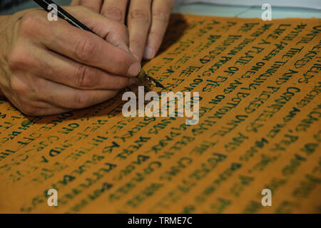 London, UK. 09 th June, 2019. Andy Moore doing some calligraphy at The London's  First Rare Book Fair, . Paul Quezada-Neiman /Alamy Live News Stock Photo