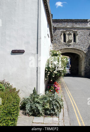 The entrance to Vicars Close in the grounds of Chichester Cathedral. West Sussex. The main road is Canon Lane and the medieval arch defends the entrance.Running parallel to the city’s West Street, on the southern side of the Cathedral, Canon Lane connects Chichester’s South Street to the Bishop’s Palace and Gardens.  Paths leading off from Canon Lane - Vicars’ Close and St Richard’s Walk - join up and give access to the Cathedral Cloisters. Stock Photo