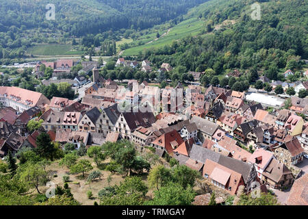 Elevated view down onto the medieval Alsatian village and surrounding countryside of Keysersberg on the wine route in eastern France. Stock Photo