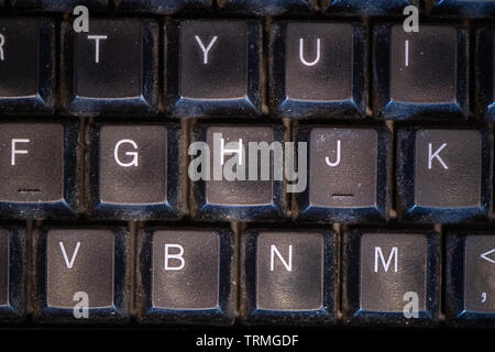 Close up of Dirty computer keyboard, showing dust and general mess. Stock Photo