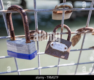 Lovers Padlocks on a Iron Fence Stock Photo