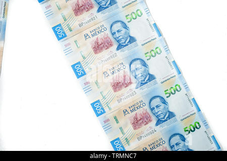 mexican money on white background. Spending, banking, business, industry, consumerism, capitalism Stock Photo