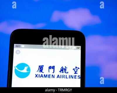 In this photo illustration the XiamenAir logo is seen displayed on a smartphone Stock Photo