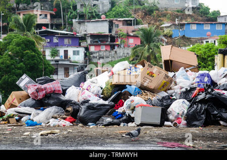 Hills of accumulated trash evidence the problems in the waste disposal system in Panama City outskirts. Stock Photo