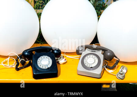 Retro analogue rotary telephones at Vinegar Yard flea market, London, UK Stock Photo