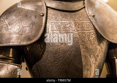 Fragment of ancient armor, decorated with etched pattern Stock Photo