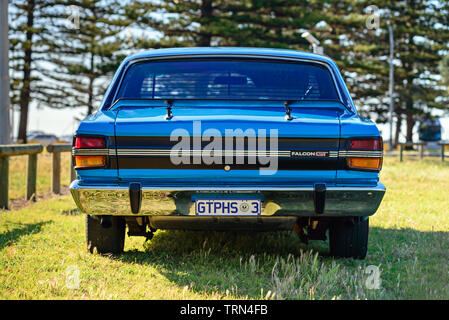 Port Adelaide, South Australia - October 14, 2017: Rear view of iconic Australian made Ford Falcon 351-GT parked on the grass on a day Stock Photo