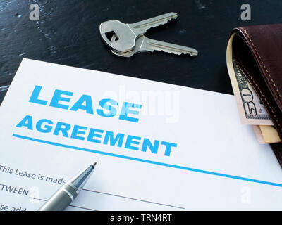 Lease agreement form, pen and house keys. Stock Photo
