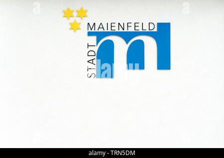 Maienfeld, GR / Switzerland - 9 June 2019: city symbol and flag of the village of Maienfeld with German text reading "City of Maienfeld" Stock Photo
