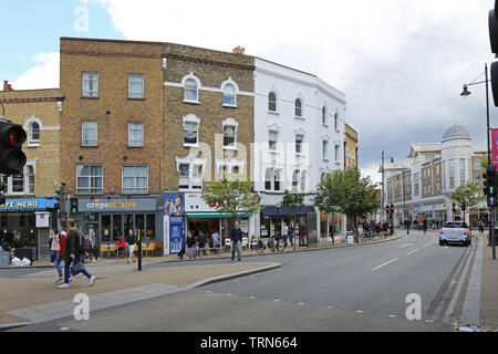 Wimbledon town centre, southwest London busy with shoppers on a  summer Saturday. View east along Wimbledon Broadway. Stock Photo