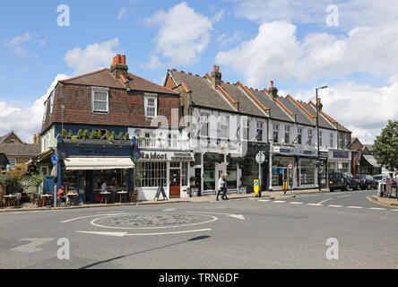 Wimbledon Village, a wealthy area of southwest London, near the famous tennis club. Shows restaurants on the junction of High Street and Church Road Stock Photo