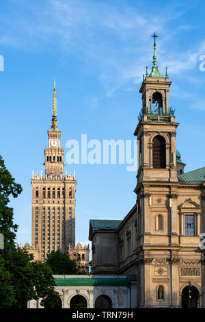 All Saints Church and Palace of Culture and Science in Warsaw, Poland. Stock Photo