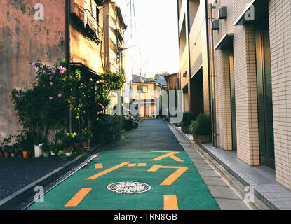 Tokyo, Japan - November 23, 2018: Quiet and empty side street in Ueno neighbourhood at sunset Stock Photo