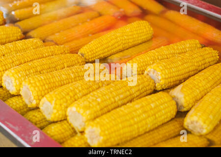 corncobs -  cooked, yellow corn for sale Stock Photo