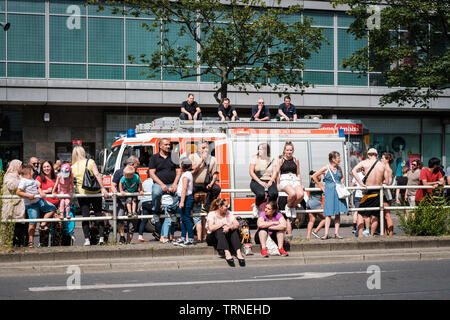 Berlin, Germany - june 2019: People /Spectators on side of the road watching Karneval der Kulturen (Carnival of Cultures) in Berlin Stock Photo