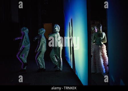 Artists of Teulis Shadow Theater during the performance in Kiev, Ukraine. Artists of the theater create performances using the flexibility and plasticity of their own body. Stock Photo