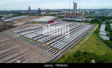 Picture shows Crossrail's new Bombardier Class 345 trains  sitting in sidings at Old Oak Common,London last week.The trains were meant to be running now but delays in the new line means they might not be used until 2021.  New aerial pictures show dozens of Crossrail's new high-tech trains sitting idle in a London depot waiting to be used.  The trains are part of a £1 billion fleet commissioned for the flagship rail project, which is believed to be costing around £17.6 billion.  Crossrail bought 70 trains, which each have room for 1,500 passengers, but only 15 of them are currently in use on ex Stock Photo