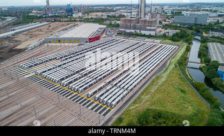 Picture shows Crossrail's new Bombardier Class 345 trains  sitting in sidings at Old Oak Common,London last week.The trains were meant to be running now but delays in the new line means they might not be used until 2021.  New aerial pictures show dozens of Crossrail's new high-tech trains sitting idle in a London depot waiting to be used.  The trains are part of a £1 billion fleet commissioned for the flagship rail project, which is believed to be costing around £17.6 billion.  Crossrail bought 70 trains, which each have room for 1,500 passengers, but only 15 of them are currently in use on ex Stock Photo