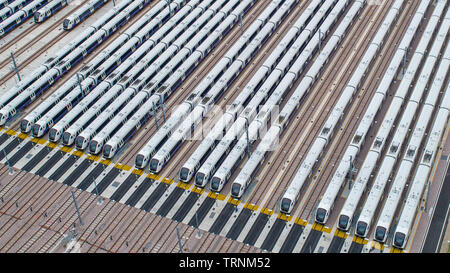 Picture shows Crossrail's new Bombardier Class 345 trains  sitting in sidings at Old Oak Common,London last week.The trains were meant to be running now but delays in the new line means they might not be used until 2021.  New aerial pictures show dozens of Crossrail's new high-tech trains sitting idle in a London depot waiting to be used.  The trains are part of a £1 billion fleet commissioned for the flagship rail project, which is believed to be costing around £17.6 billion.  Crossrail bought 70 trains, which each have room for 1,500 passengers, but only 15 of them are currently in use on ex Stock Photo