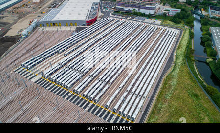 Picture shows Crossrail's new Bombardier Class 345 trains  sitting in sidings at Old Oak Common,London last week.The trains were meant to be running now but delays in the new line means they might not be used until 2021.  New aerial pictures show dozens of Crossrail's new high-tech trains sitting idle in a London depot waiting to be used.  The trains are part of a £1 billion fleet commissioned for the flagship rail project, which is believed to be costing around £17.6 billion.  Crossrail bought 70 trains, which each have room for 1,500 passengers, but only 15 of them are currently in use on ex Stock Photo