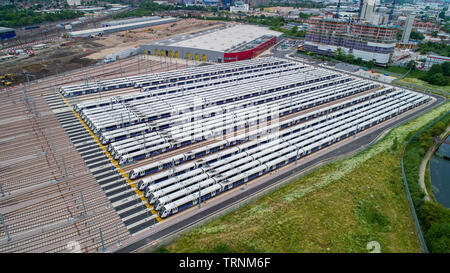 Picture shows Crossrail's new Bombardier Class 345 trains  sitting in sidings at Old Oak Common,London last week.The trains were meant to be running now but delays in the new line means they might not be used until 2021.  New aerial pictures show dozens of Crossrail's new high-tech trains sitting idle in a London depot waiting to be used.  The trains are part of a £1 billion fleet commissioned for the flagship rail project, which is believed to be costing around £17.6 billion.  Crossrail bought 70 trains, which each have room for 1,500 passengers, but only 15 of them are currently in use on ex Stock Photo