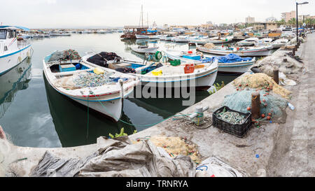 Boats and fishing nets in Tyre harbour in early morning, Tyre, Lebanon Stock Photo