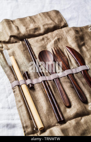 Eco friendly wooden bamboo cutlery in a tissue box. Plastic free concept. Stock Photo