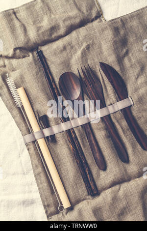 Eco friendly wooden bamboo cutlery in a tissue box. Plastic free concept. Stock Photo