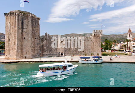 Medieval Kamerlengo Castle, anchored by its feudal tower of chains, welcomes visitors to Trogir's waterfront. Founded by Greeks in the 3rd century BC, Stock Photo