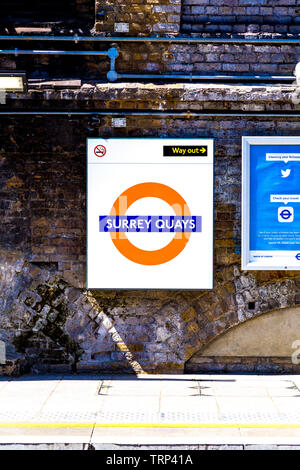Sign for Surrey Quays on an Overground train platform, London, UK Stock Photo
