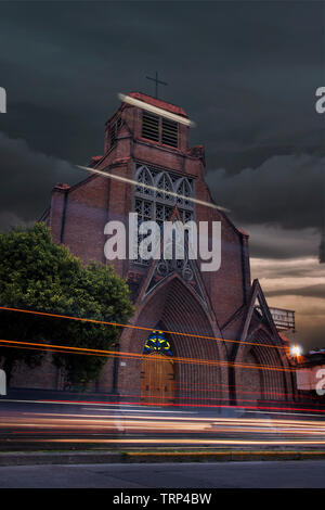 church at night with light painting trails from the cars Stock Photo