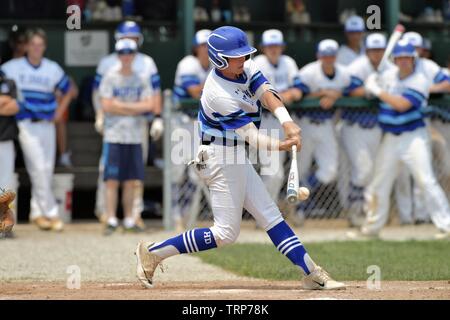 Batter making solid contact on a pitch. USA. Stock Photo