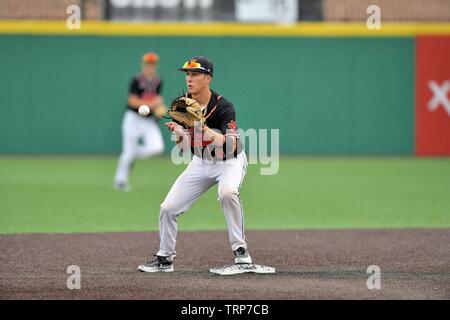 Second baseman accepting a throw from the shortstop for a force out at second base to end an inning. USA. Stock Photo