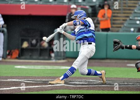 Batter making solid contact on a pitch. USA. Stock Photo